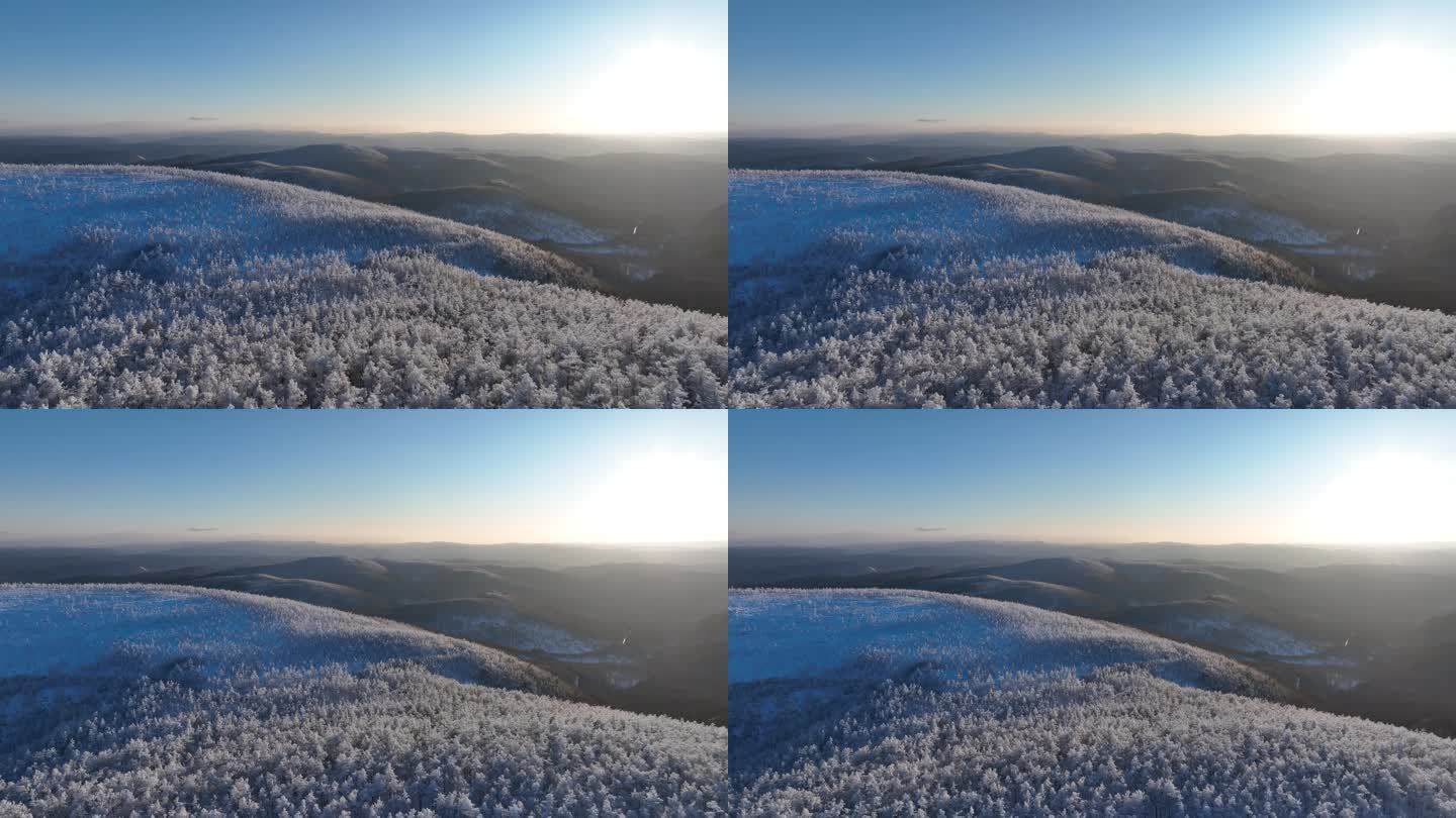 航拍逶迤山岭雪林雾凇夕照