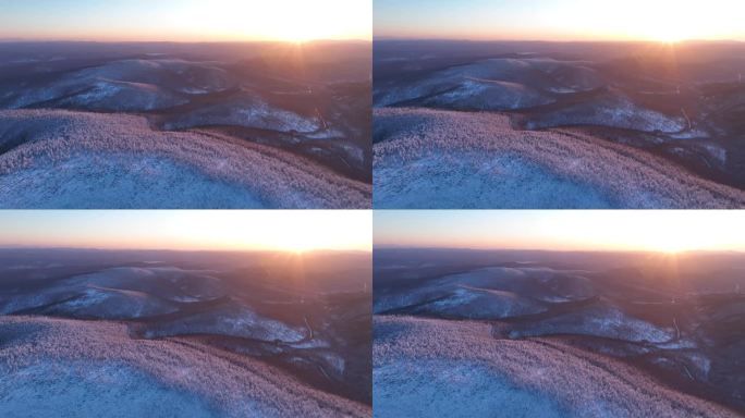 航拍逶迤山岭雪林雾凇夕照