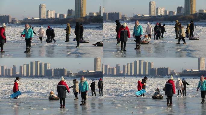 冰冻的松花江上人们带着孩子溜冰嬉戏