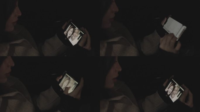 美女看着手机在车上跟父母视频通话