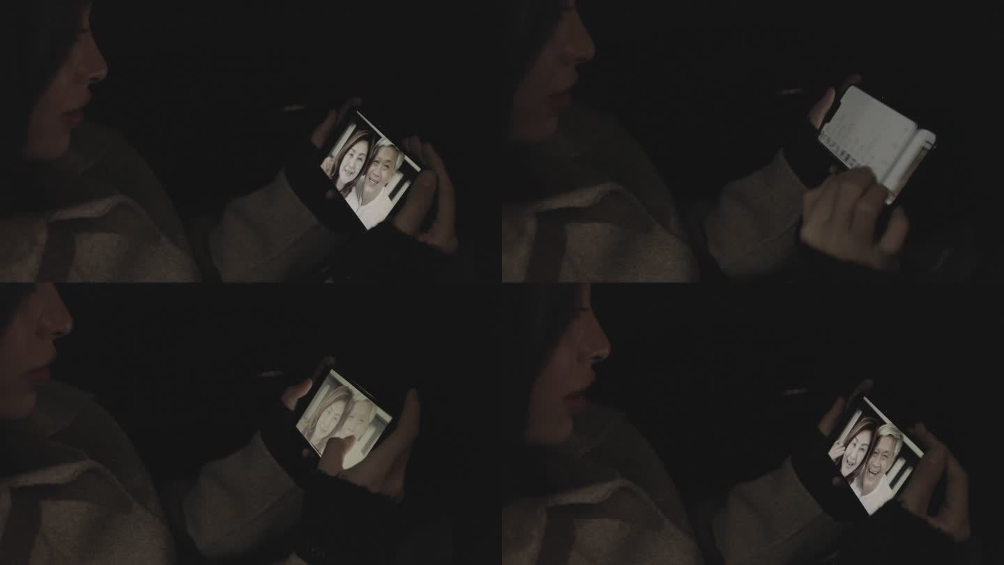 美女看着手机在车上跟父母视频通话