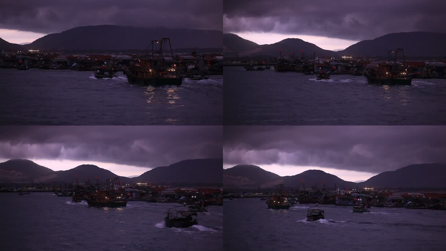 海南岛渔港清晨出港的渔船