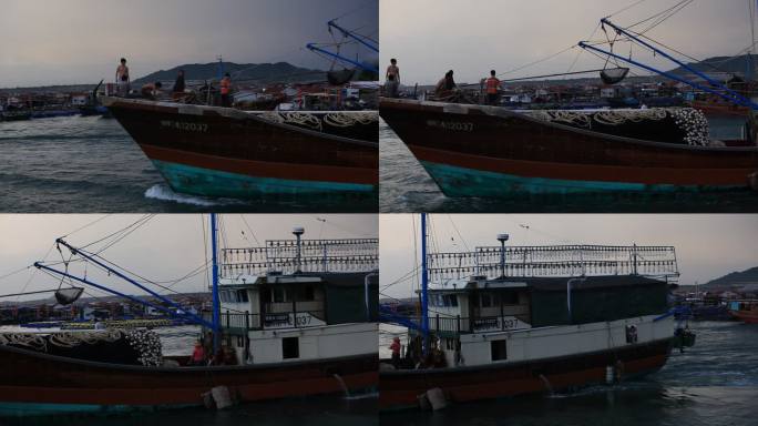 海南岛渔港清晨出海的货轮