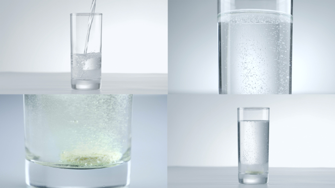 往水杯里倒水 维C泡腾片溶解