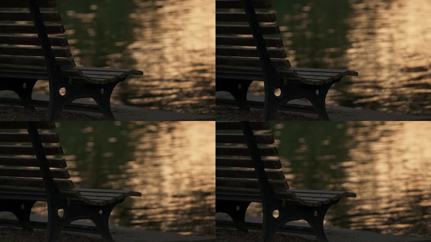 黄昏时间公园座椅和湖面