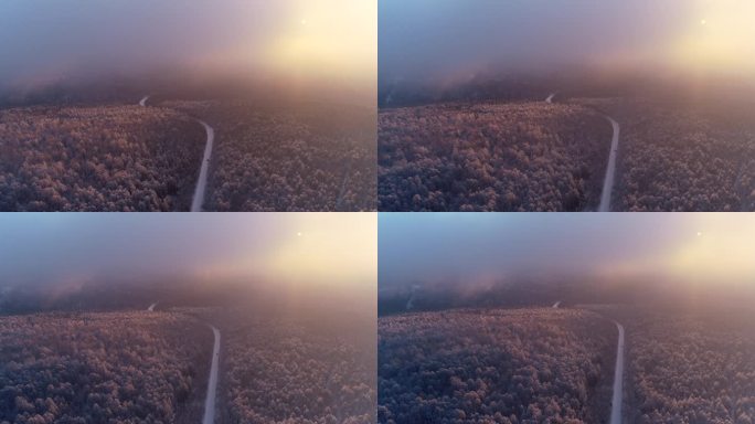 航拍冬季山林雾凇晨雾朝阳