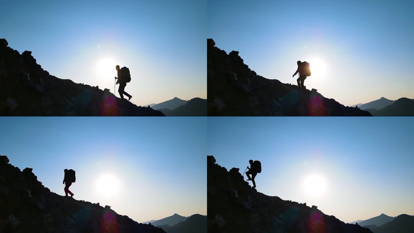 背包客逆光登山爬山脚步人物剪影攀登顶峰