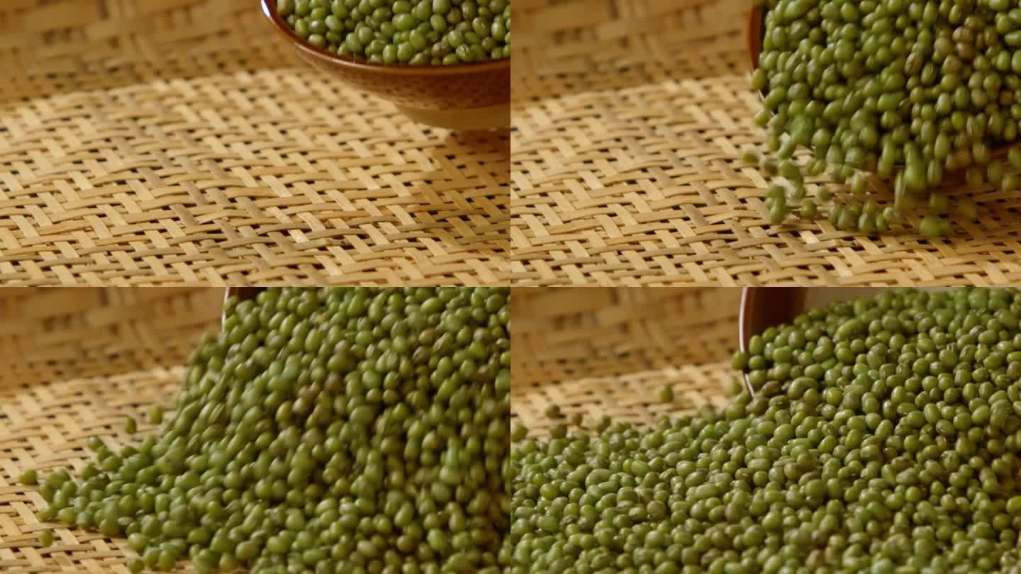 一碗绿豆洒落到竹筛里
