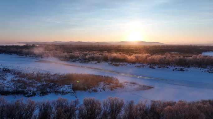 航拍冬季丛林河湾雪景朝阳