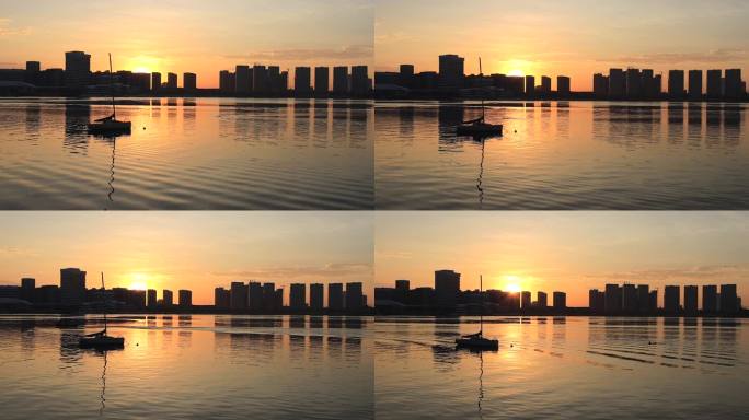 快镜头拍摄城市海湾日出映照海面