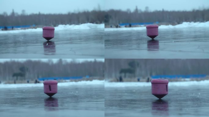 冰面上抽陀螺 陀螺旋转 冰尜