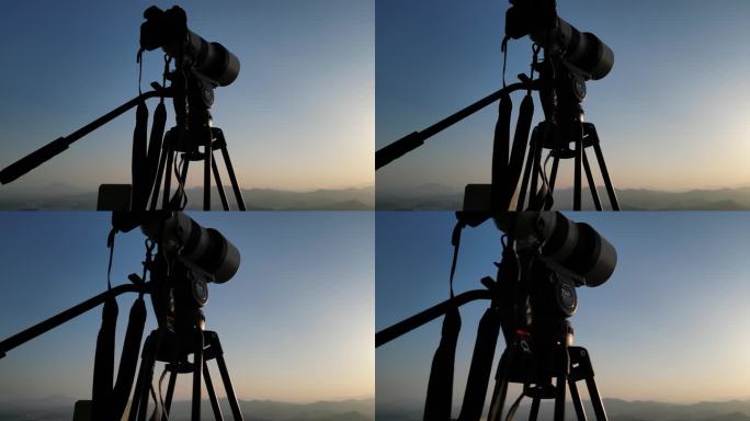 黄昏日落夕阳下的摄影器材剪影