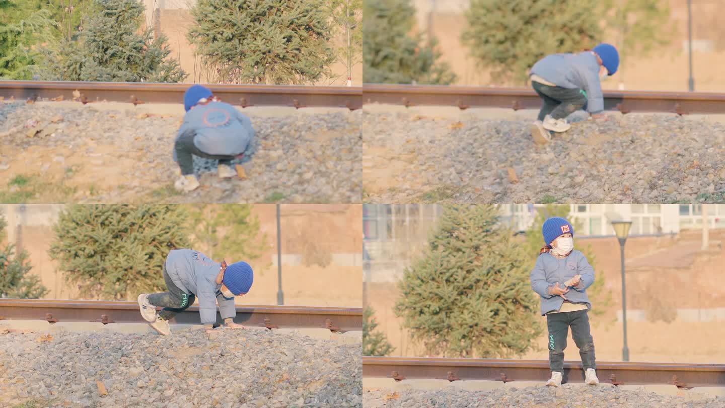 小孩铁道玩耍