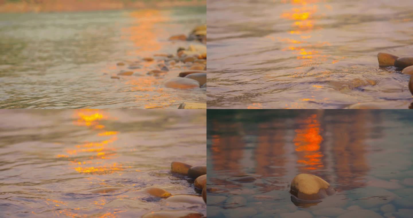 金色夕阳下水面水流水花涌上沙滩鹅卵石