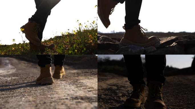 脚步徒步马丁靴户外徒步-行者走在泥沙路上