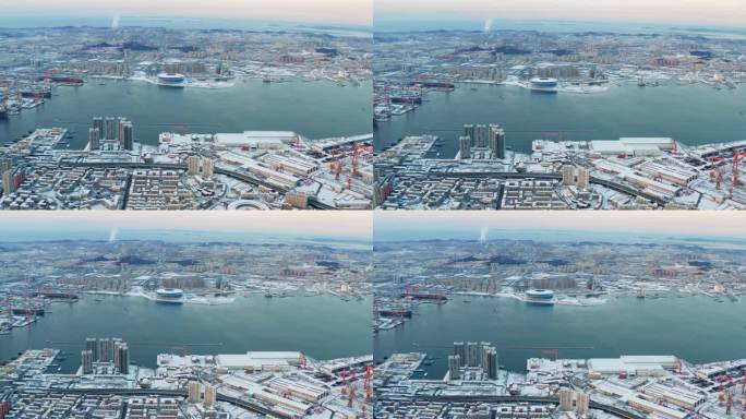 航拍大连梭鱼湾体育场造船厂海边雪景