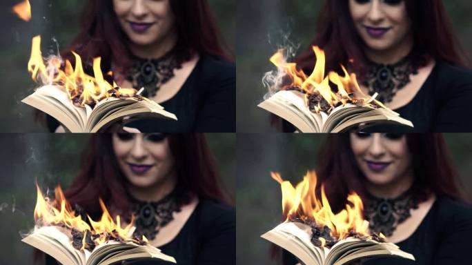 手持燃烧书的哥特式女人