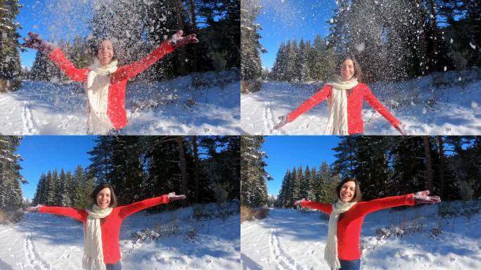 年轻女子扔雪国外美女红毛衣冬天玩雪花