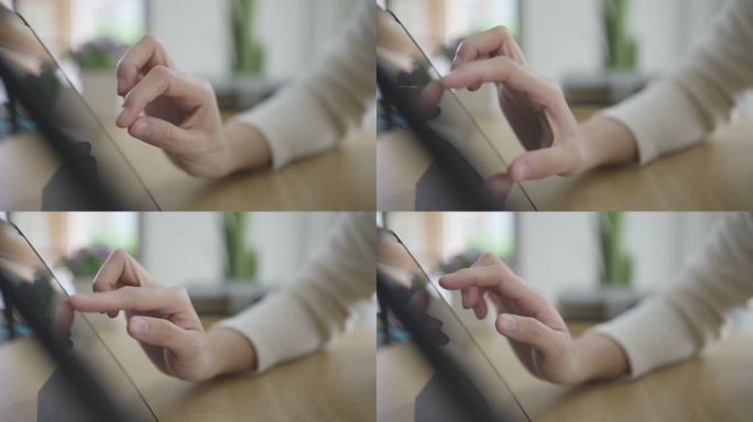 在数字平板电脑上使用数码笔的手特写