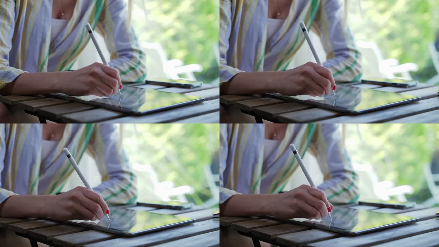 女商人使用数字化笔在数字平板电脑上写字