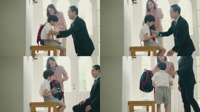 早上好，准备上学。英俊的亚洲父亲正在为他的小男孩打扮，准备上学的第一天，而美丽的亚洲母亲则在旁边准备