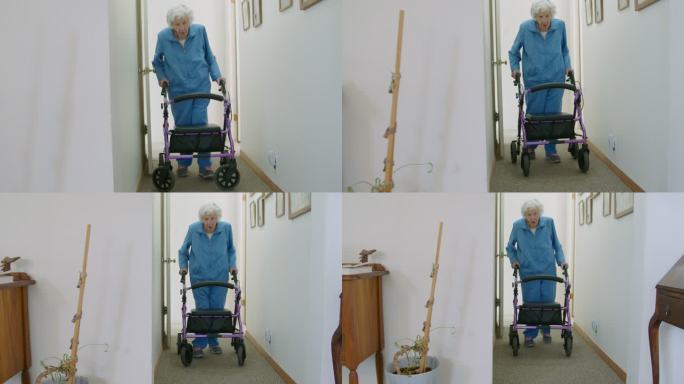 手持照片：一位独立的老年妇女带着一辆代步车沿着走廊穿过她家