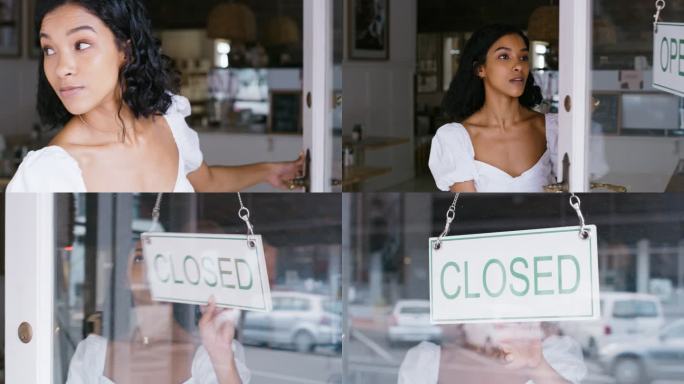 年轻的女企业家在一天结束时关闭了她的商店。一个小餐馆老板正在关闭她的商店。一名妇女在城里的商店门口将