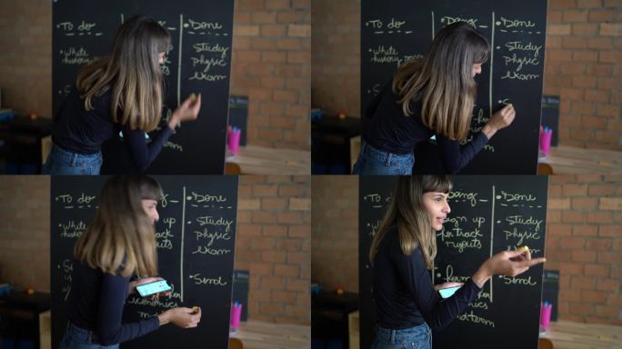 年轻女子在演讲中在黑板上写字