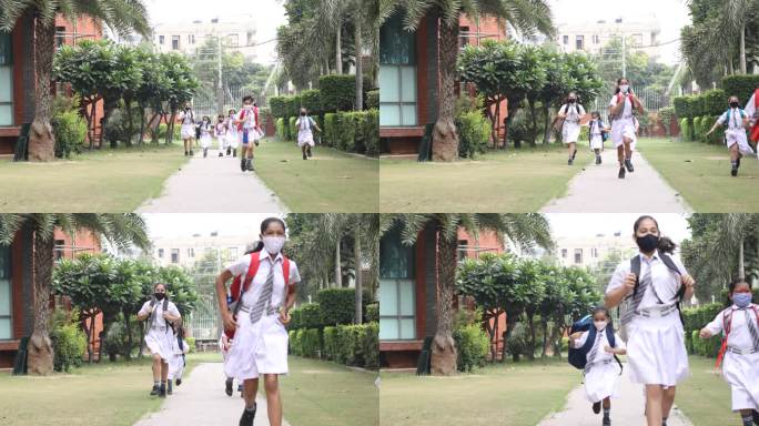 戴着防护面罩的儿童跑步上学