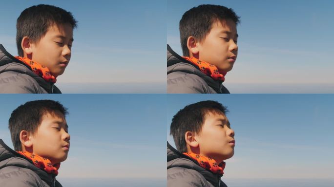 健康和放松的混血亚洲青少年男孩祈祷，平静的面部表情，积极的心理健康