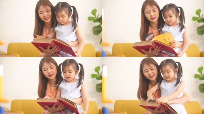 可爱的妈妈和孩子一起看书
