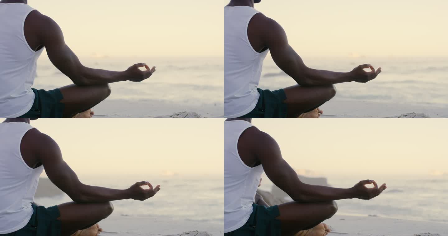 日落时分，一名男子在海滩上做瑜伽的4k视频片段