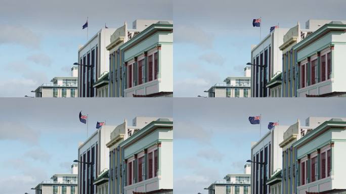 国旗在装饰艺术的Napier建筑上空飘扬的慢镜头