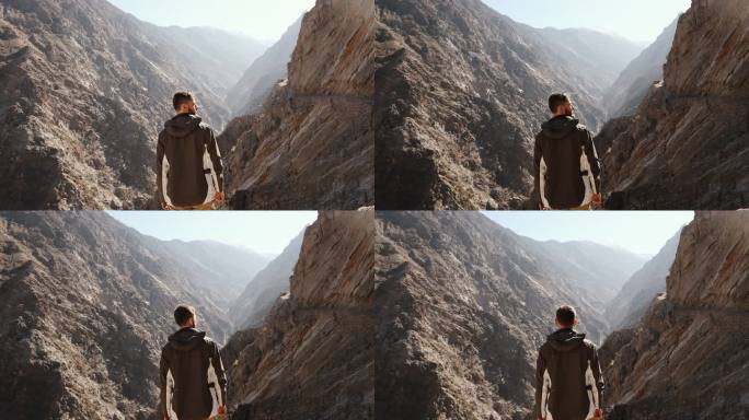 在喜马拉雅山上看风景秀丽的峡谷的男人