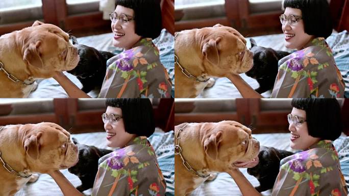 女人在家里用爱拥抱可爱的狗