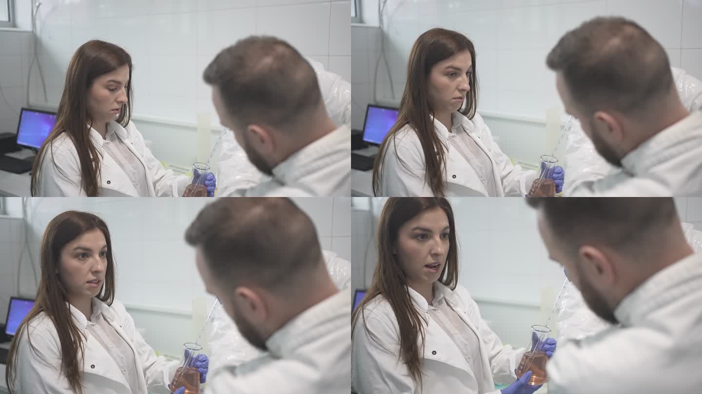 男女化学家在慢动作视频中进行实验