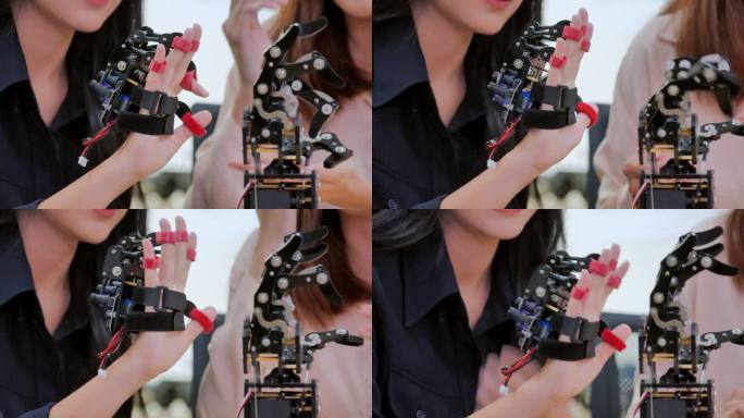 特写一个十几岁的女孩在研究实验室里与开发工程师玩得很开心的未来假肢机器人手臂。手臂移动手指。工业4.