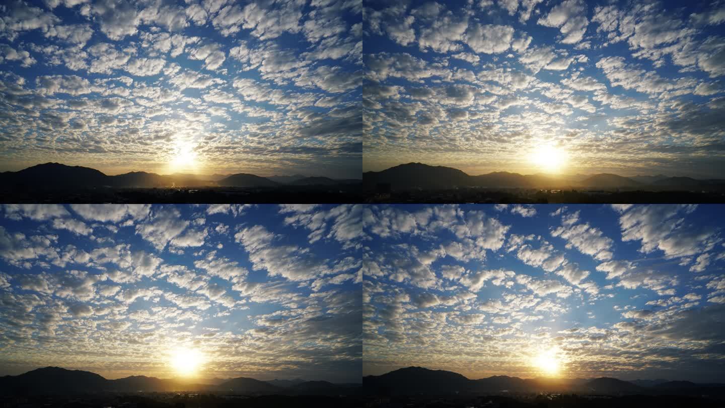 傍晚夕阳天空云朵延时乡村日落阳光穿过云层