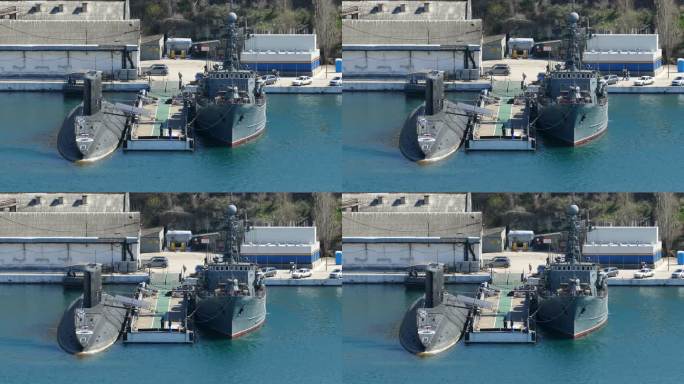 码头上的潜艇和扫雷艇