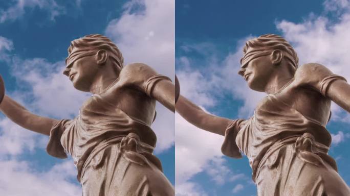 正义雕像和云彩延时垂直视频