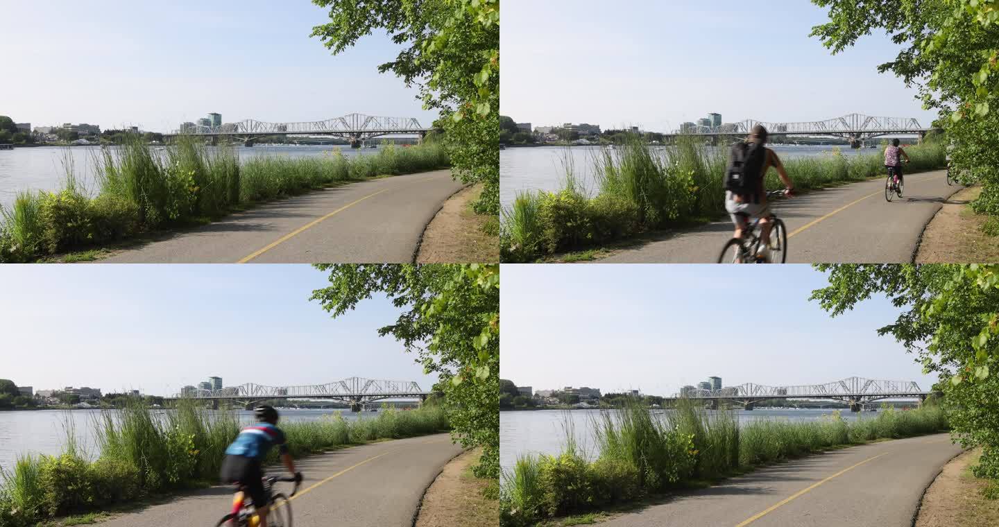 渥太华河边的加蒂诺河自行车道，朝向亚历山德拉大桥