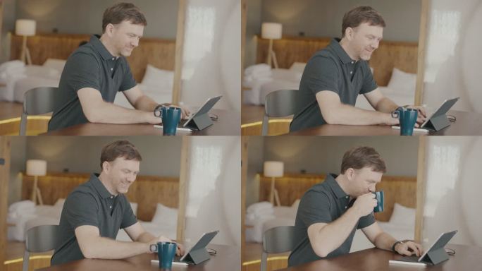 男子在享用早晨咖啡时使用数字平板电脑
