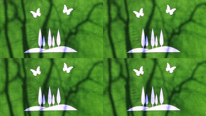 蝴蝶盘旋在一片树林上方造型绿底白色标牌