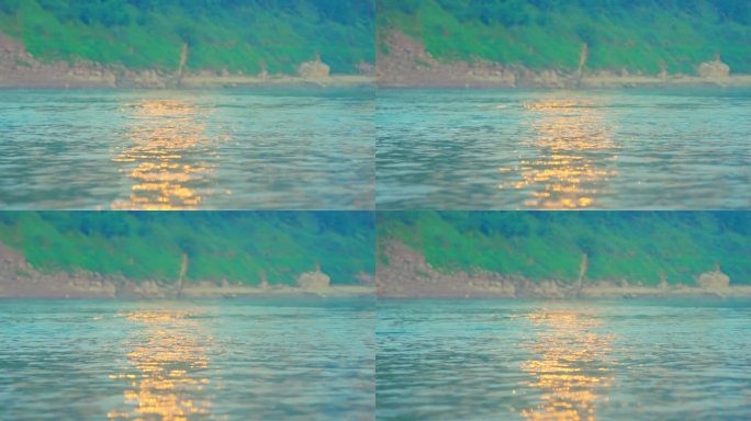 水纹波光粼粼金色水面荡漾阳光洒满湖面