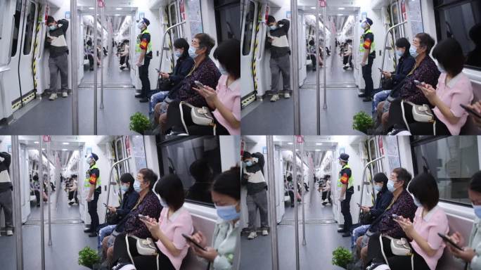 地铁进站慢镜车厢内人群看手机