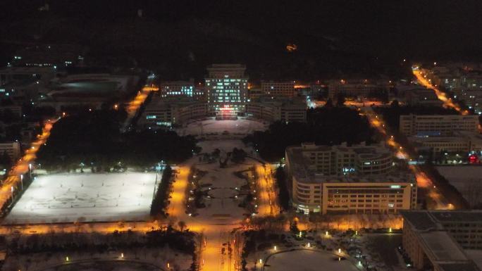 航拍雪后山东大学威海校区夜景
