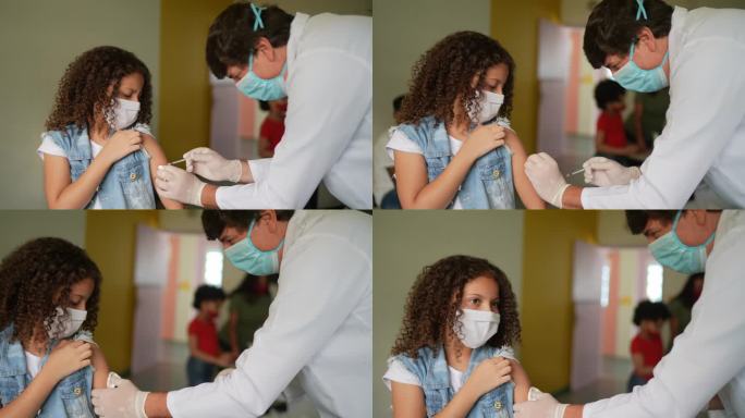 女童在接种中心接种疫苗