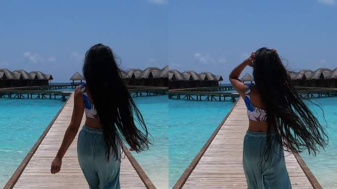 在马尔代夫度假期间，一名亚洲女子在码头上散步，享受阳光