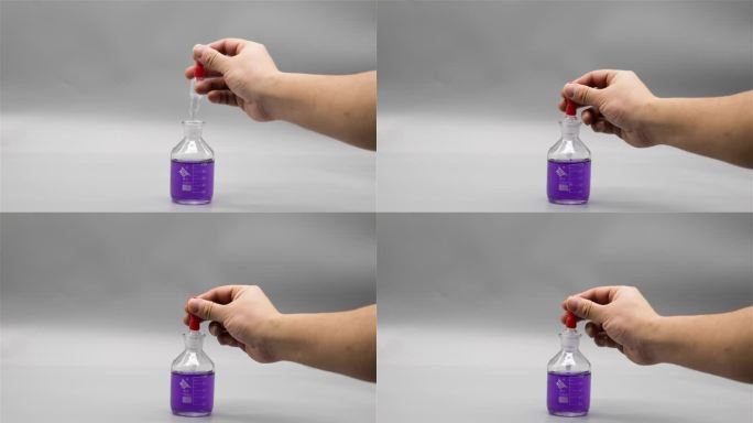 用滴管在滴瓶里吸取紫色溶液