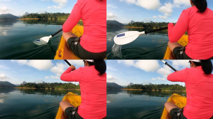 亚洲女子皮划艇在阳光下的热带大湖上午。放松运动